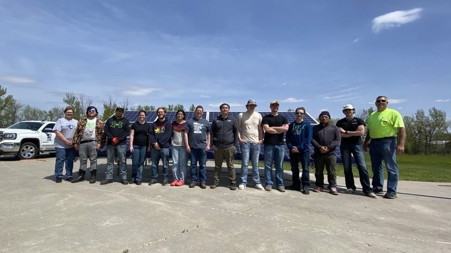 solar camp students in front of array