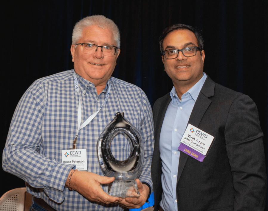 Bruce Peterson holding Award next to Vivek Arora
